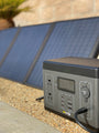 SeeDevil™ 300w 280Wh Portable Power Station beside solar panels